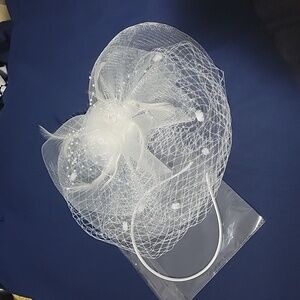 White Fascinator with rose detail and birdcage veil